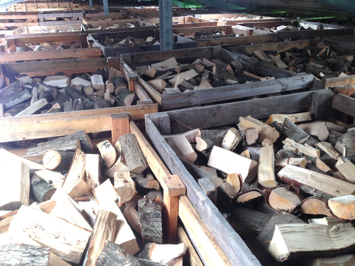 Barn stored logs after kiln drying